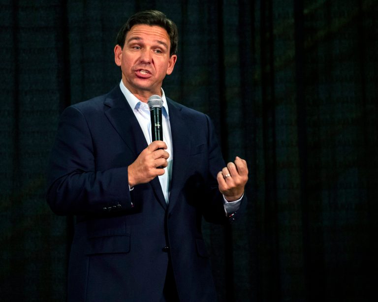 Gov. Ron DeSantis (R-FL) speaks during Rep. Mariannette Miller-Meeks's (R-IA) Triple MMM Tailgate event in Iowa City, Iowa, on Friday, Oct. 20, 2023. The event featured remarks from several candidates for the Republican Party's nomination for president. 