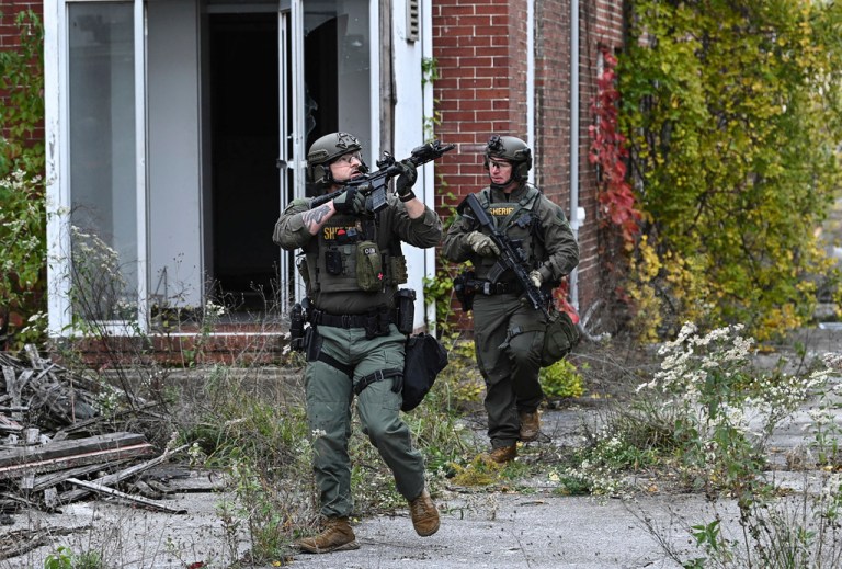 Officers with the Frederick County Sheriiff's Dept. SWAT Team search for suspect Pedro Argote at the former Garden State Tannery plant in Williamsport, Md. on Saturday, Oct. 21, 2023.