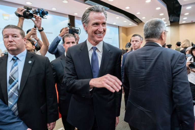 Gov. Gavin Newsom (D-CA), center, leaves the lecture hall after attending the fireside chat at the Hong Kong University in Hong Kong, Monday, Oct. 23, 2023. Newsom said on Monday that his state will always be a partner on climate issues no matter how the U.S. presidential election next year turns out during his weeklong trip to China, in an attempt to reinforce his region's role as a global leader on climate change.