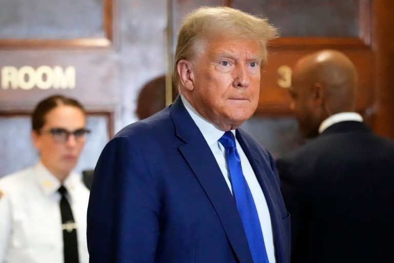 Former President Donald Trump speaks during a break in his civil business fraud trial at New York Supreme Court, Wednesday, Oct. 25, 2023, in New York. The judge in Trump's civil fraud trial has fined the former president $10,000. The judge says Trump violated a limited gag order barring personal attacks on court staffers.