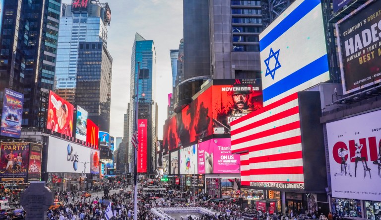 Israeli Americans and supporters hold displays of kidnapped loved ones and signs calling for their return, Thursday Oct. 26, 2023, in New York. 
