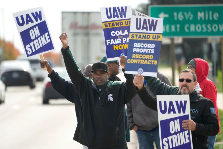 United Auto Workers members walk the picket line during a strike at the Stellantis Sterling Heights Assembly Plant, in Sterling Heights, Mich., Monday, Oct. 23, 2023. 