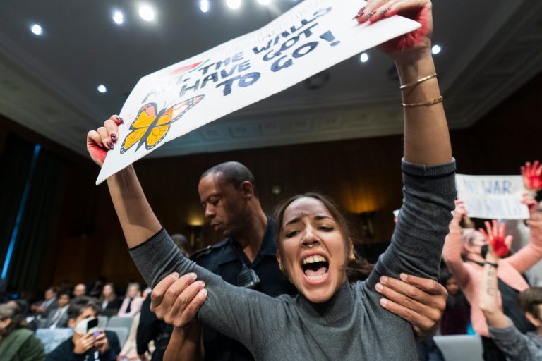 Protesters calling for a ceasefire in Gaza, raise their hands painted red, symbolizing blood, during a Senate Appropriations Committee hearing to examine the national security supplemental request, on Capitol Hill in Washington, Tuesday, Oct. 31, 2023. 