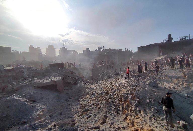 Palestinians inspect the damage of buildings destroyed by Israeli airstrikes on Jabaliya refugee camp on the outskirts of Gaza City on Oct. 31, 2023. In just 25 days of war, more than 3,600 Palestinian children have been killed in Gaza, according to Gaza's Hamas-run Health Ministry. The advocacy group Save The Children says more children were killed in Gaza in October 2023 than in all conflict zones around the world combined in 2022.