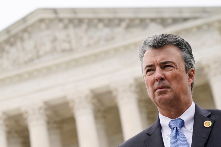 Alabama Attorney General Steve Marshall listens to a reporter's question following oral arguments in an Alabama redistricting case, outside the Supreme Court on Capitol Hill in Washington on Oct. 4, 2022.