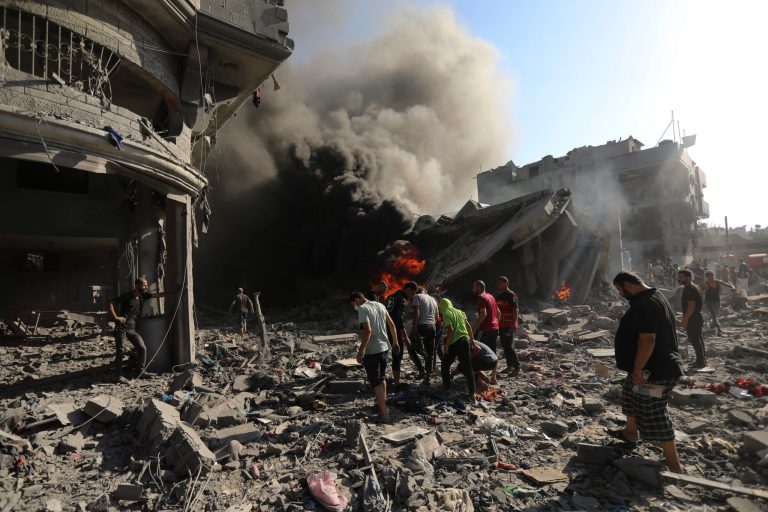 Palestinians inspect the damage of a house destroyed by an Israeli airstrike in Gaza City on Nov. 4, 2023.