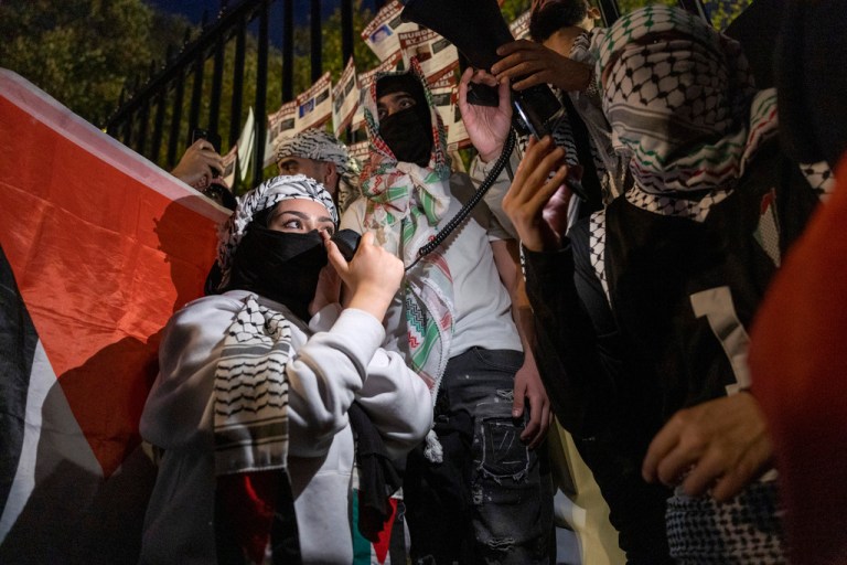 A woman leads a chant during a pro-Palestinian demonstration in front of the White House in Washington on Saturday, Nov. 4, 2023.