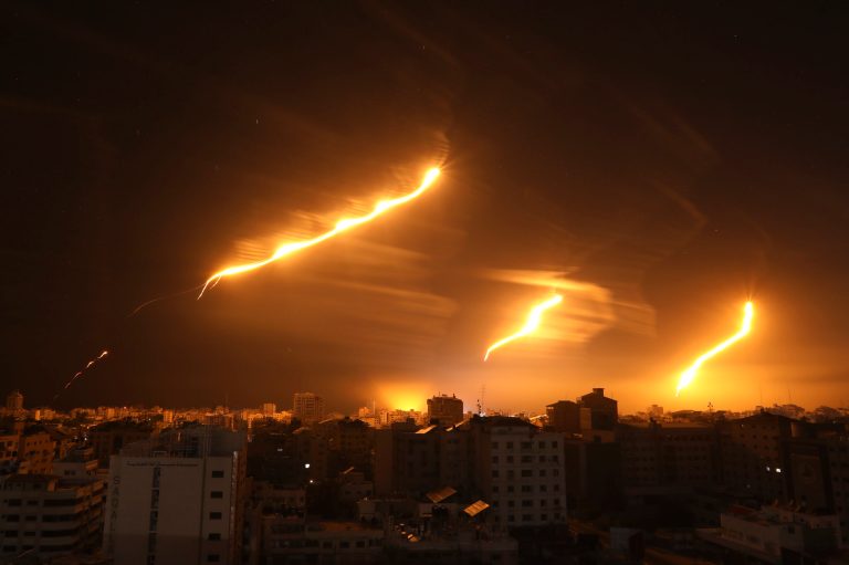 Long exposure photo shows Israeli forces' flares light up the night sky in Gaza City, Monday, Nov. 6, 2023.