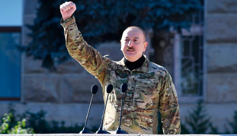 In this photo provided by the Azerbaijan's Presidential Press Office, Azerbaijani President Ilham Aliyev delivers his message during a parade dedicated to the third anniversary of the Victory in the Patriotic War in Khankendi, also known by Armenians as Stepanakert, in Nagorno-Karabakh, Wednesday, Nov. 8, 2023. Azerbaijanis celebrate the third anniversary of their victory in the 2020 Nagorno-Karabakh war after Azerbaijan gained the full control over the separatist region in fighting earlier this year.
