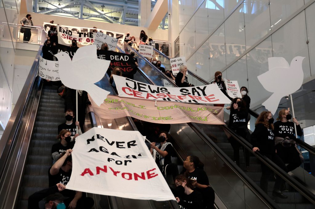 Israel war: Israel-Hamas ceasefire protesters block escalators at Chicago tower