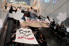 Israel war: Israel-Hamas ceasefire protesters block escalators at Chicago tower