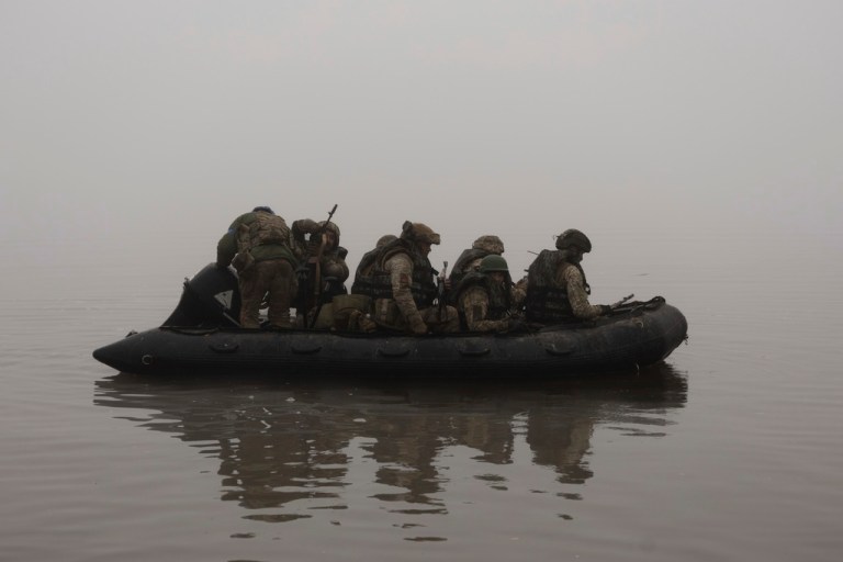 FILE - Ukrainian marines sail along the Dnipro river at the frontline near Kherson, Ukraine, Saturday, Oct. 14, 2023.