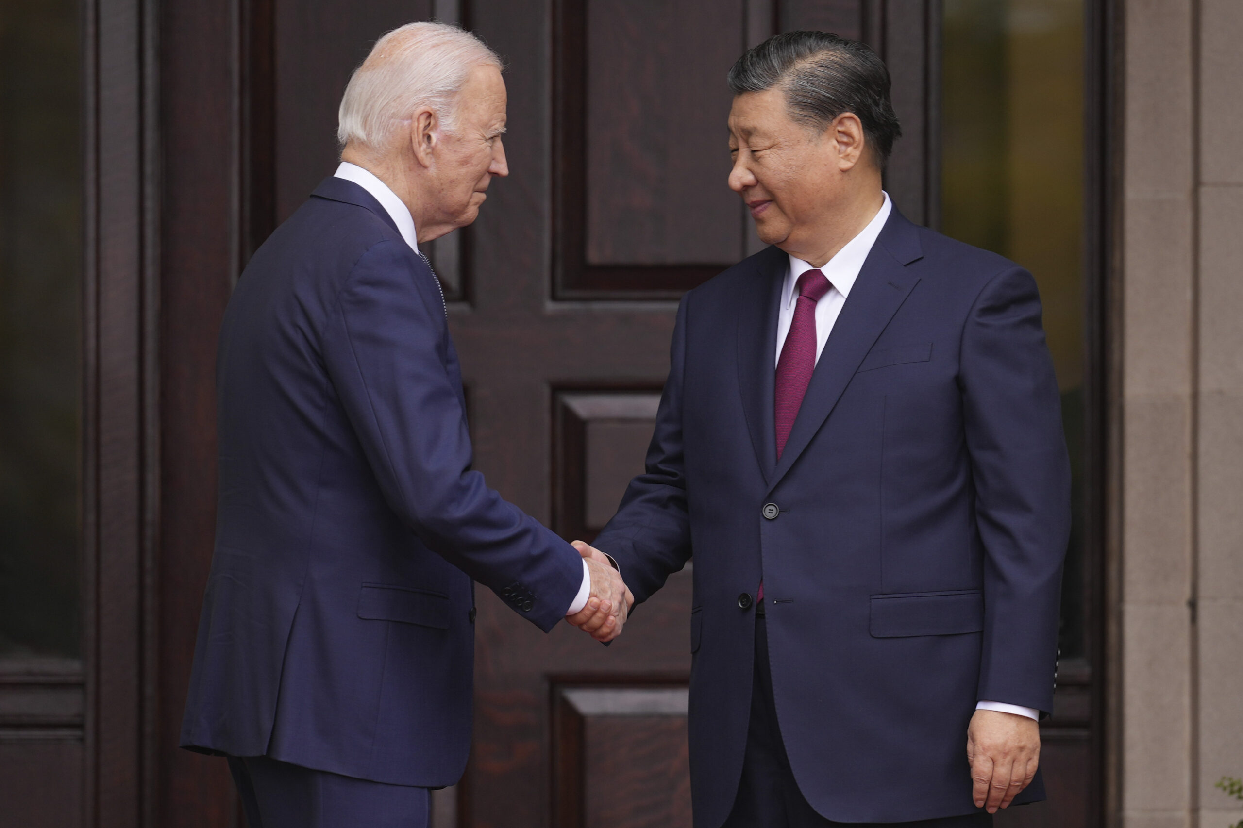 Blinken appears to shake his head and wince when Biden says Xi Jinping is a dictator