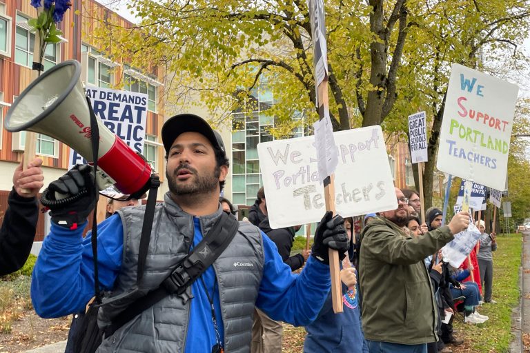 Teachers and their supporters hold signs, chant, and rally the crowd with bullhorns on the first day of a teacher's strike in Portland, Oregon, on Nov. 1, 2023.