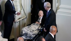 Jimmy Carter emerges from hospice to pay tribute draped in blanket with Rosalynn’s image