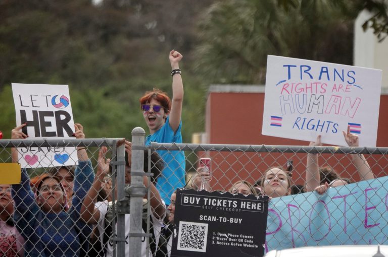 Students from Monarch High School in Coconut Creek, Florida, walk out of the school building Tuesday, Nov. 28, 2023, in support of a transgender student who plays on the girls volleyball team. 