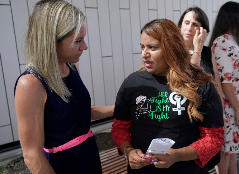 FILE - Amanda Zurawski, left, who developed sepsis and nearly died after being refused an abortion when her water broke at 18 weeks, talks with Samantha Casiano, who was forced to carry a nonviable pregnancy to term and gave birth to a baby who died four hours after birth, outside the Travis County Courthouse, July 19, 2023, in Austin, Texas. 