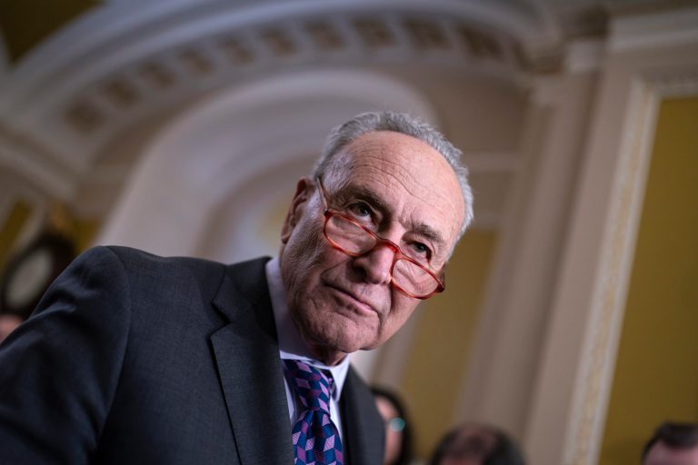 Senate Majority Leader Chuck Schumer, D-N.Y., answers questions from reporters outside the Senate chamber, at the Capitol in Washington, Tuesday, Nov. 28, 2023. (AP Photo/J. Scott Applewhite)