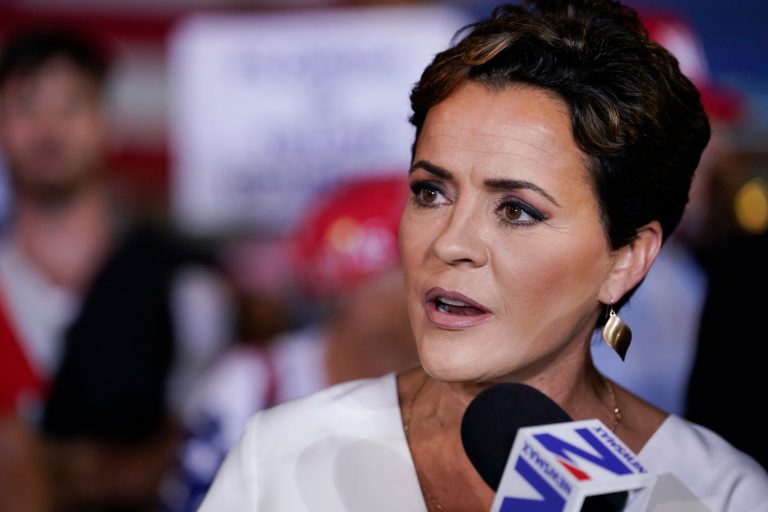 Former Arizona Republican gubernatorial candidate Kari Lake talks in the Spin Room after former President Donald Trump held a campaign rally, Nov. 8, 2023, in Hialeah, Florida.