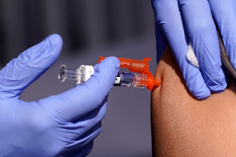 FILE - A patient is given a flu vaccine Friday, Oct. 28, 2022, in Lynwood, Calif.   