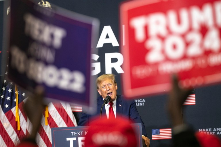 Former President Donald Trump speaks to the crowd during a caucus event, Saturday, Dec. 2, 2023, at Kirkwood Community College in Cedar Rapids, Iowa.