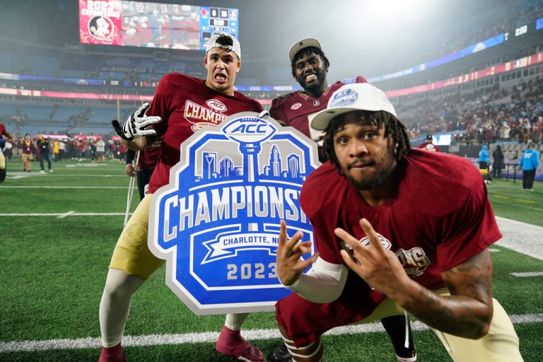 Florida State players pose after defeating Louisville in the Atlantic Coast Conference championship NCAA college football game Saturday, Dec. 2, 2023, in Charlotte, N.C.