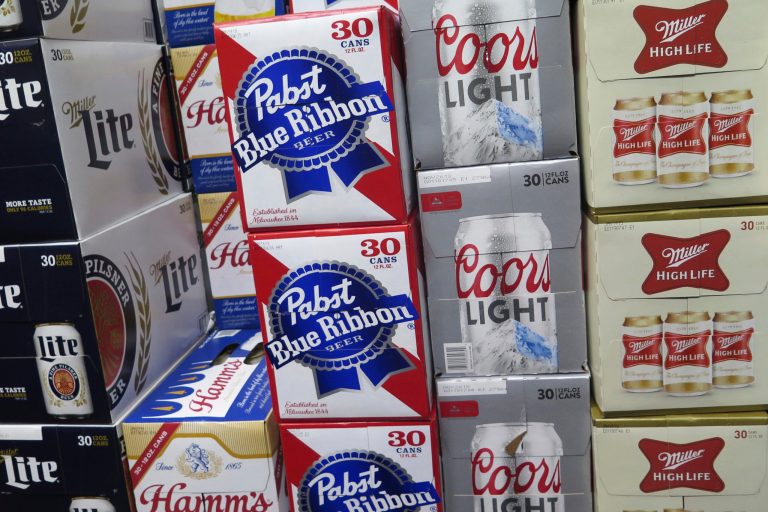 FILE - Cases of beer are stacked next to each other in a Milwaukee liquor store, Nov. 8, 2018. (AP Photo/Ivan Moreno, File)