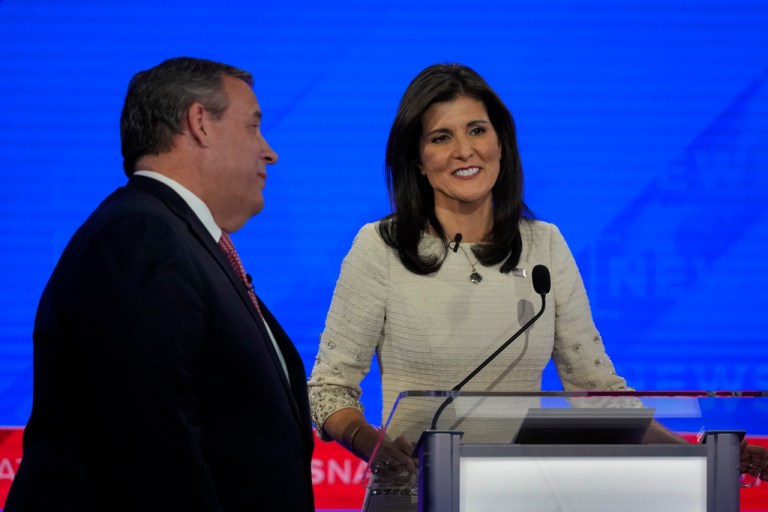 Republican presidential candidates Chris Christie and former U.N. Ambassador Nikki Haley talk during a commercial break of a Republican presidential primary debate hosted by NewsNation on Wednesday, Dec. 6, 2023, at the Moody Music Hall at the University of Alabama in Tuscaloosa, Alabama.