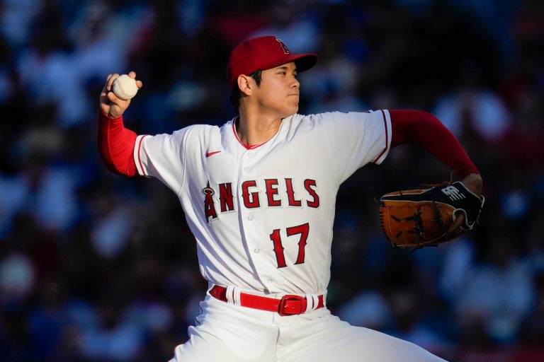 Los Angeles Angels starting pitcher Shohei Ohtani throws during a game against the Los Angeles Dodgers in Anaheim, California, on June 21, 2023. Ohtani agreed Saturday, Dec. 9, to a record 10-year, $700 million contract with the Dodgers.
