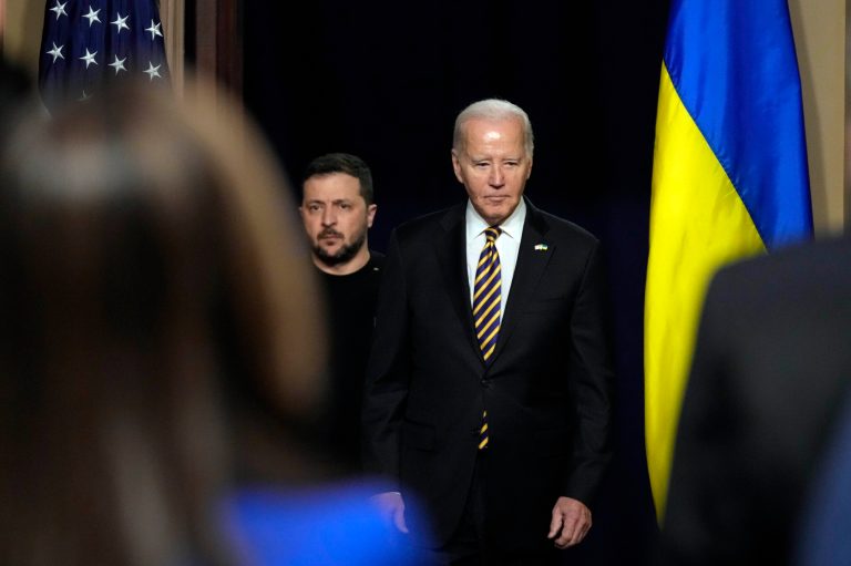 President Joe Biden and Ukrainian President Volodymyr Zelenskyy arrive for a news conference in the Indian Treaty Room in the Eisenhower Executive Office Building on the White House Campus, Tuesday, Dec. 12, 2023, in Washington.