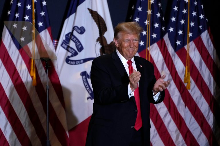 Former President Donald Trump walks off stage during a commit to caucus rally, Wednesday, Dec. 13, 2023, in Coralville, Iowa.