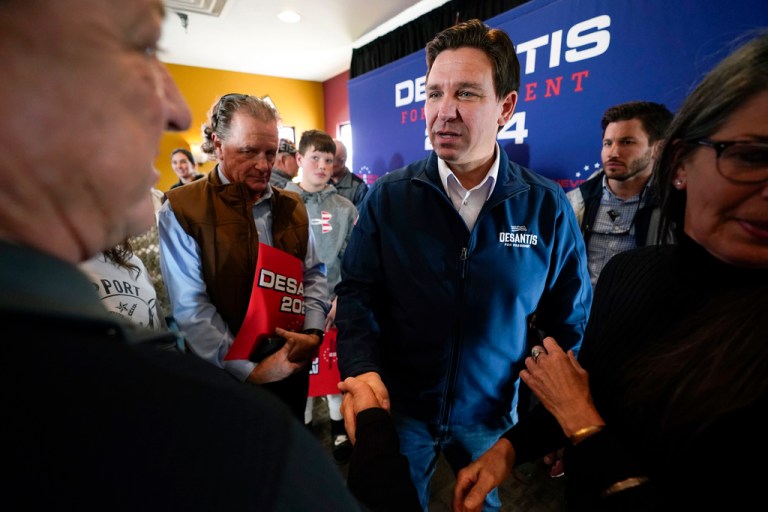 Republican presidential candidate Florida Gov. Ron DeSantis talks with audience members during a meet and greet, Friday, Nov. 3, 2023, in Denison, Iowa. 