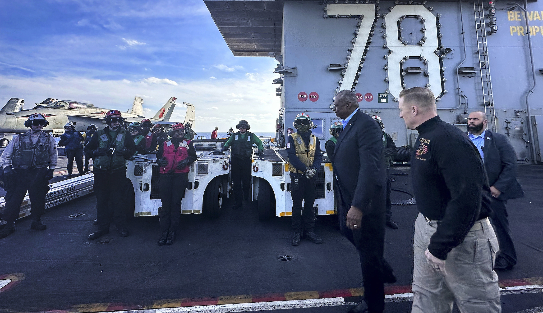 Austin visits troops on Gerald Ford, ‘linchpin of preventing a wider regional conflict’