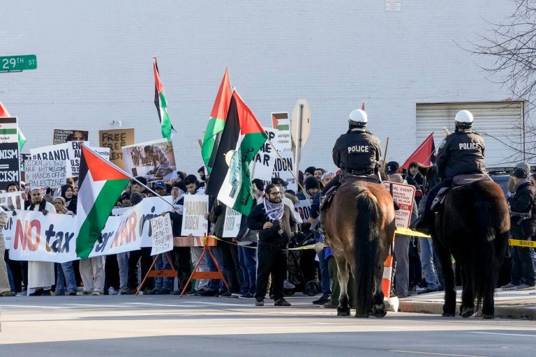 Protesters gather outside the Wisconsin Black Chamber of Commerce on Wednesday, Dec. 20, 2023, in Milwaukee, where President Joe Biden spoke.