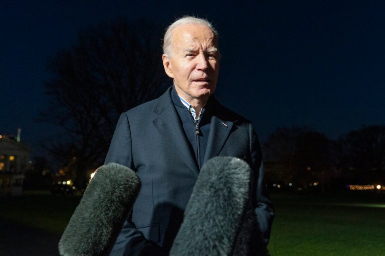 FILE - President Joe Biden answers a reporter's question as he walks from Marine One upon arrival on the South Lawn of the White House, Dec. 20, 2023, in Washington.  (AP Photo/Alex Brandon, File)