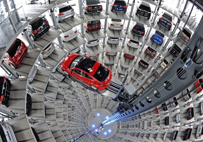 SEE IT: Scientists glue themselves to the floor of a Volkswagen exhibit hall