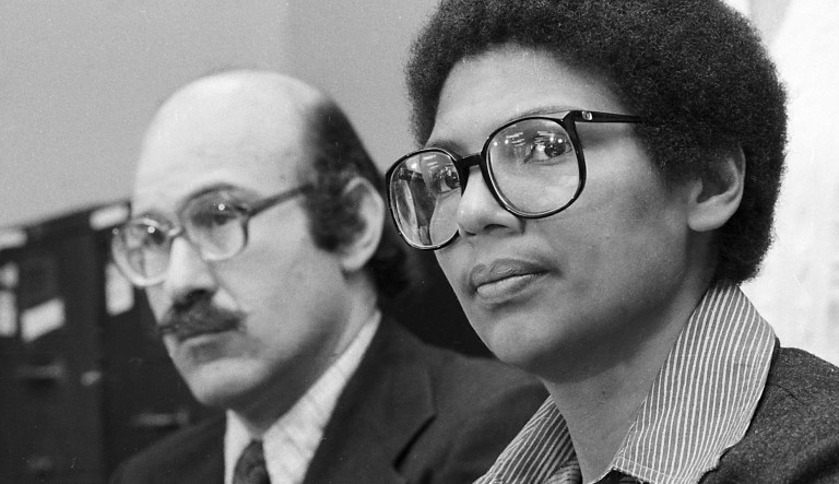 In this April 24, 1980, file photo, Olympic bronze medalist Anita DeFrantz, right, and Ira Glasser, executive director of the American Civil Liberties Union, announce a lawsuit in New York by athletes against the U.S. Olympic Committee for depriving Americans the opportunity to compete in the Moscow Games. 