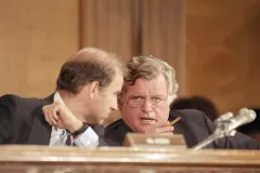 Ted Kennedy whispering in Biden’s ear