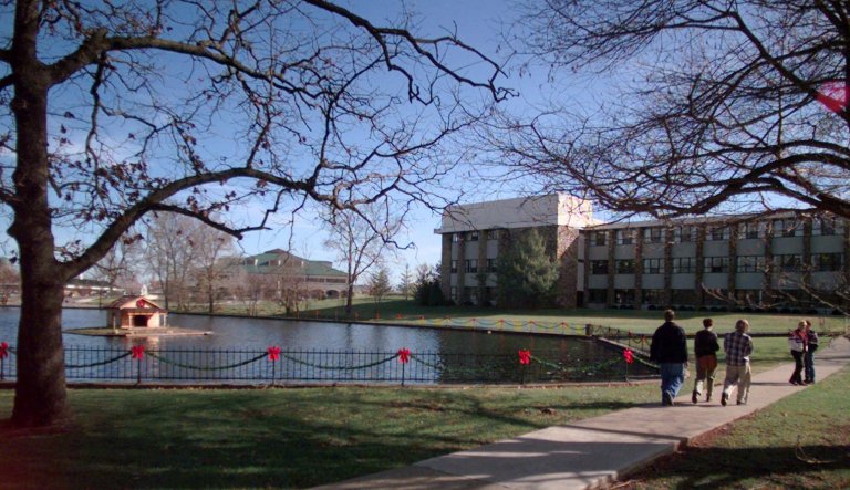 In this Dec. 10, 1999, file photo Students walk on the campus of the College of the Ozarks in Point Lookout, Mo. The Springfield News-Leader reported Monday, April 16, 2012, a college preparatory high school connected to the College is set to open in August. Students at the private Christian school will clean classrooms, prepare meals and do other chores in lieu of tuition, which the college students also can do.