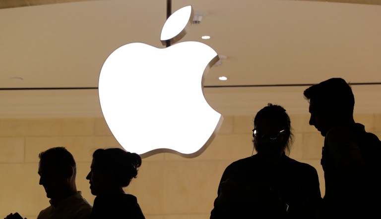 FILE - In this May 31, 2018, file photo, customers enter the Apple store, in New York. Apple will build a $1 billion campus in Austin, Texas, break ground on smaller locations in Seattle, San Diego and Culver City, California, and over the next three years will expand in Pittsburgh, New York and Colorado.