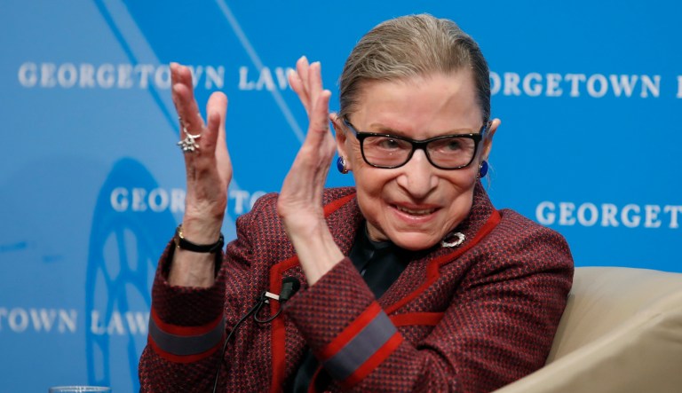Supreme Court Justice Ruth Bader Ginsburg applauds after a performance in her honor after she spoke about her life and work during a discussion at Georgetown Law School in Washington on Friday, April 6, 2018.