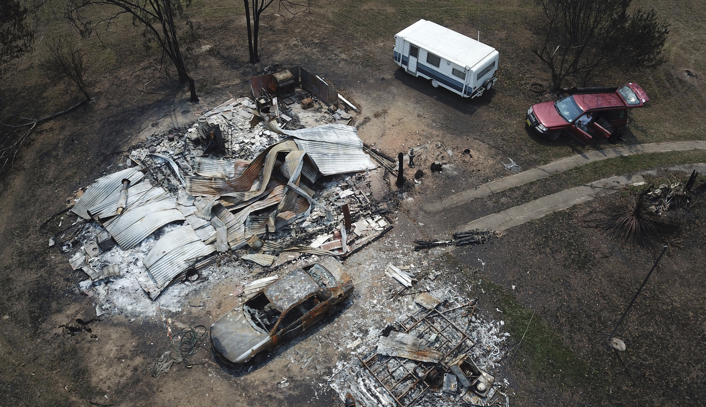 Suburbs of Australian capital evacuated after fire ignites near airport