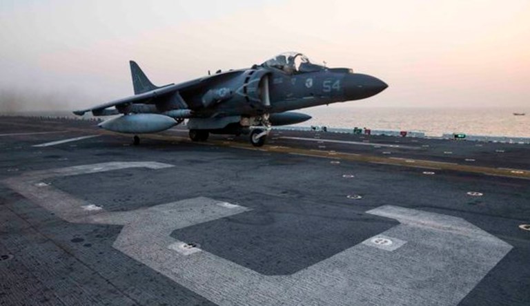 An AV-8B Harrier assigned to Marine Medium Tiltrotor Squadron 162 launches from an amphibious assault ship. 