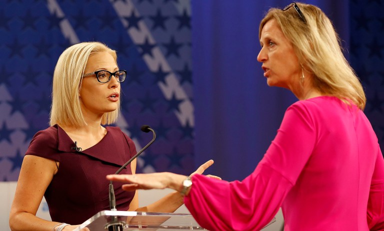 U.S. Rep. Kyrsten Sinema, D-Ariz., left, goes over the rules in a television studio prior to a televised debate with U.S. Rep. Martha McSally, R-Ariz.