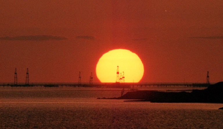 The sun rises over the Neftyanye Kamny,  or Oil Stones, rigs at the shore of the Kaspian Sea in Baku, Azerbaijan.