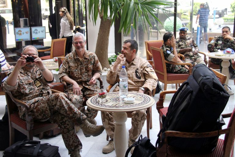   U.N. observers are seen at the Dama Rose hotel in Damascus, Syria, on Sunday, June 17, 2012. U.N. observers suspended their patrols in Syria due to a recent spike in violence, the strongest sign yet that an international peace plan was unraveling despite months of diplomatic efforts to prevent the country from plunging into civil war. The observers' decision came after weeks of escalating attacks, including reports of several mass killings that have left dozens dead. (AP Photo/Bassem Tellwai)  