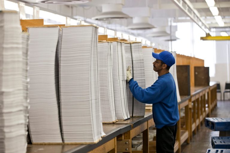 FILE - In this April 8, 2013, file photo, printed copies of President Barack Obama's proposed budget plan for fiscal year 2014 are prepared for binding at the U.S. Government Printing Office in Washington, Monday, April 8, 2013. Six years into his presidency, Obama is unveiling a budget on Tuesday, March 4, 2014, for fiscal year 2015 that for once does not herald a partisan legislative showdown. There's no push to overhaul health care as he did in 2009, no drive as in 2010 to restrict Wall Street, or to increase taxes as in 2011 and 2012, or to halt automatic spending cuts as in 2013. (AP Photo/J. Scott Applewhite)