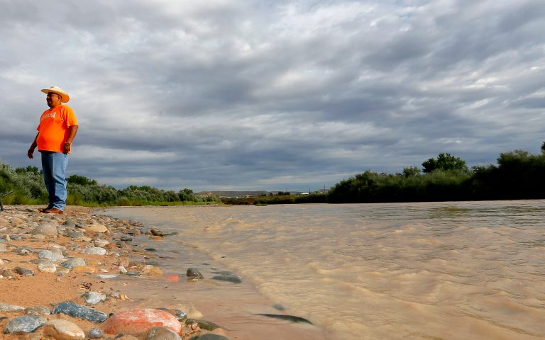 Navajo Nation Council Delegate Davis Filfred walks along the San Juan River, Tuesday, Aug. 11, 2015, in Montezuma Creek, Utah. (AP Photo/Matt York)