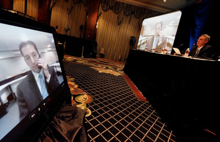 Associated Press Denver News Editor James Anderson, right, facilitates a question and answer session with investigative journalist Glenn Greenwald via teleconference from Rio de Janeiro Brazil, during an event at the annual conference of the 69th Annual General Assembly of the Inter American Press Association, at the Brown Palace Hotel, in Denver, Monday Oct. 21, 2013. Greenwald, who's source is NSA leaker Edward Snowden, cowrote a story in Monday's Le Monde newspaper outlining details of the NSA's eavesdropping program in France, in which reportedly some 70 million calls were monitored in one month by the spy agency. (AP Photo/Brennan Linsley)