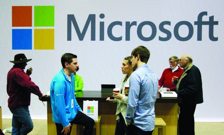 FILE - In this Nov. 28, 2012, file photo, Microsoft Corp. retail store employees and guests mingle at a pop-up Microsoft Store during Microsoft's annual meeting of shareholders, in Bellevue, Wash. Longtime users of Hotmail, MSN and other Microsoft email services will start noticing a big change: When they sign in to check messages, they'll be sent to a new service called Outlook.com. (AP Photo/Ted S. Warren,File)